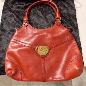 Authentic Gucci Britt Medium Leather Top Handle Bag in red with signature GG med